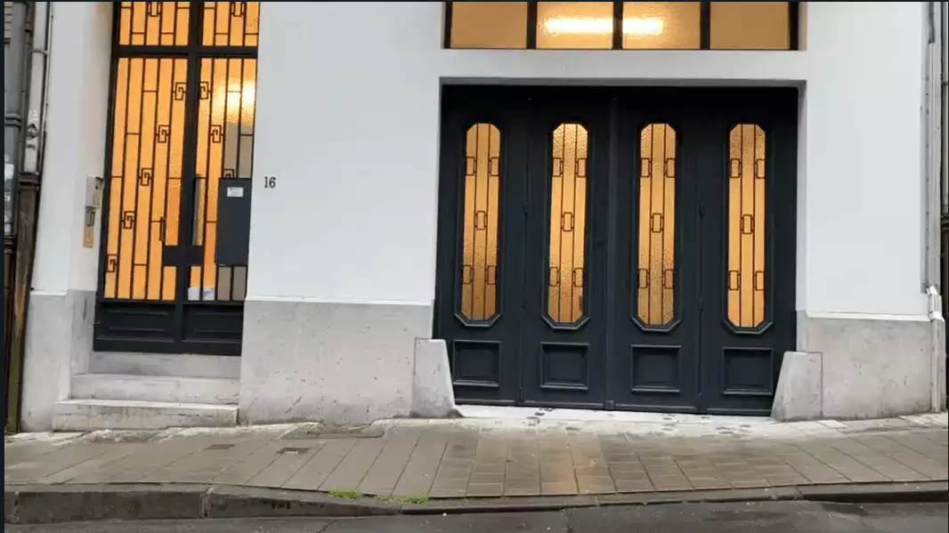 Glazed garage door with metal fittings