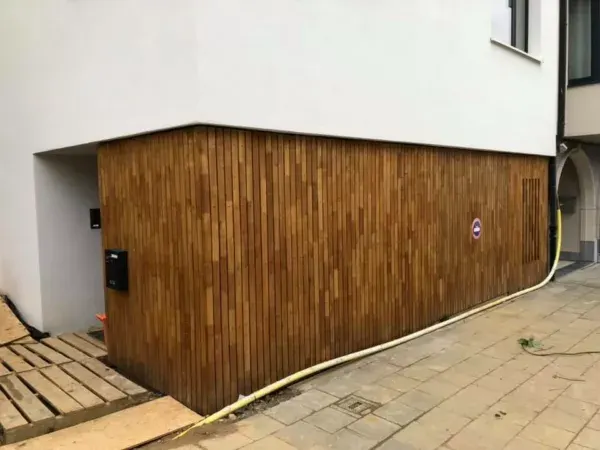 Invisible garage door with vertical wood cladding